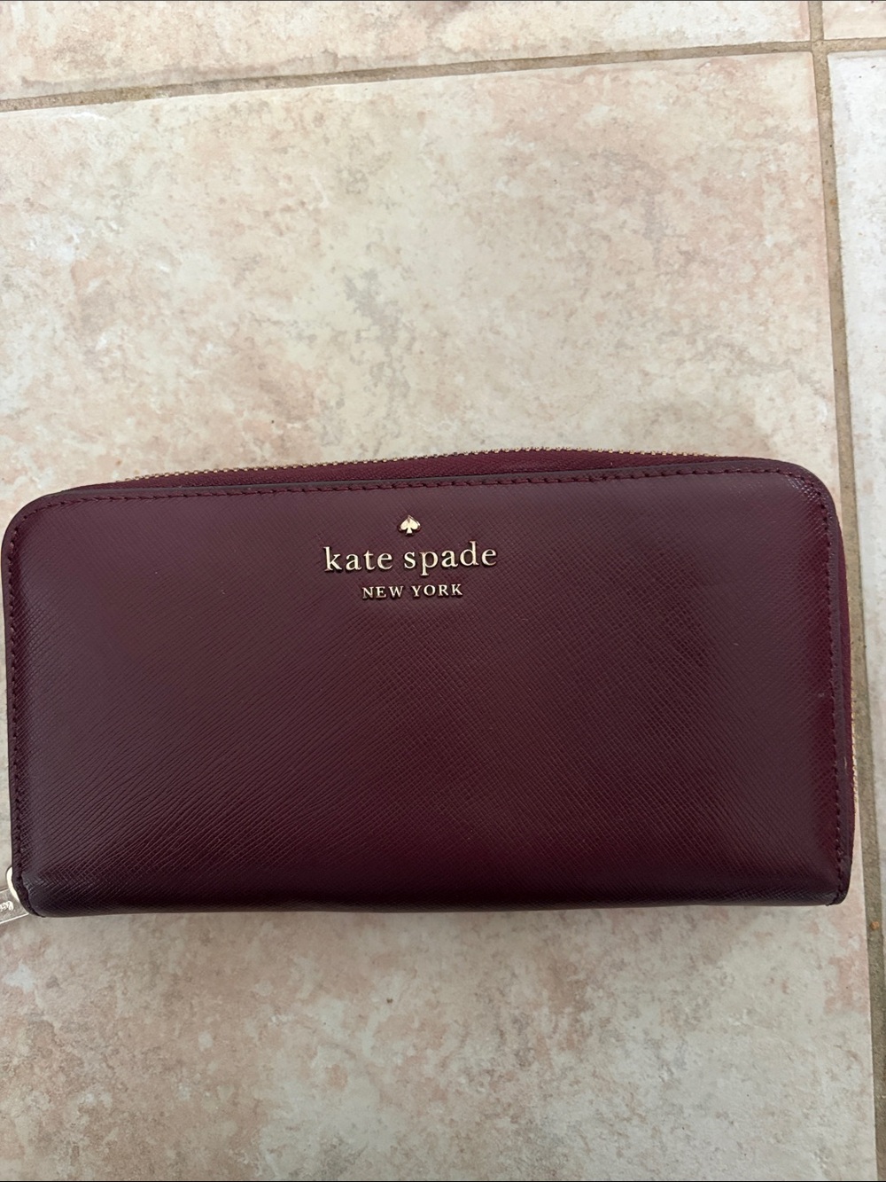 kate spade Burgundy Zip-Around Saffiano Wallet with Gold Logo